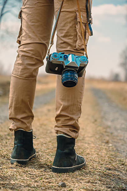 istock Traveler with vintage photo camera 498952451