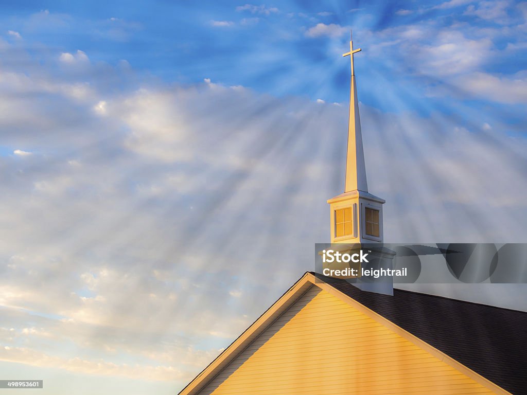 Bright cross shining church dawn Blue Stock Photo