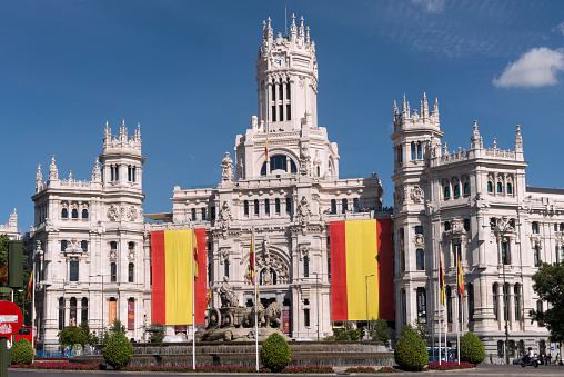 Madrid,Spain  - June 21, 2014: The Plaza de Cibeles is a square with a neo-classical complex of marble sculptures with fountains that has become an iconic symbol for the city of Madrid.Behind the fountain of Cibeles is the city council. In the past it was the post office and communications