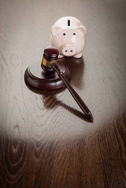 istock Gavel and Piggy Bank on Table 498955981