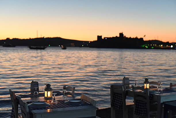 Romantic dinner on the beach at sunset time