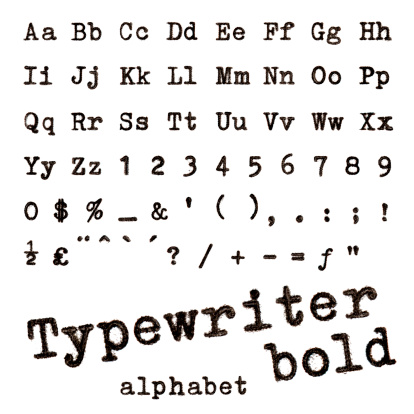 Typewriter bold alphabet. Macro photograph of typewriter letters isolated on white.