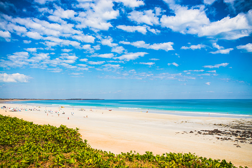 People enjoying Western Australia's iconic Cable Beach in Broome.