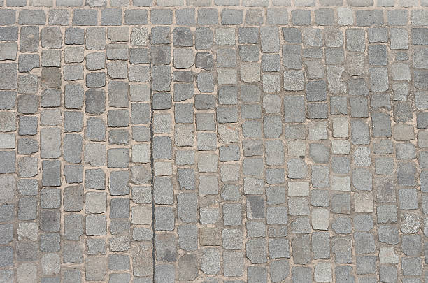 istock Old road paved with granite stones 498956680