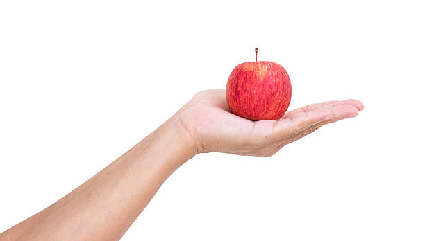 istock Man hand holding apple isolated on white background, clipping pa 498956985