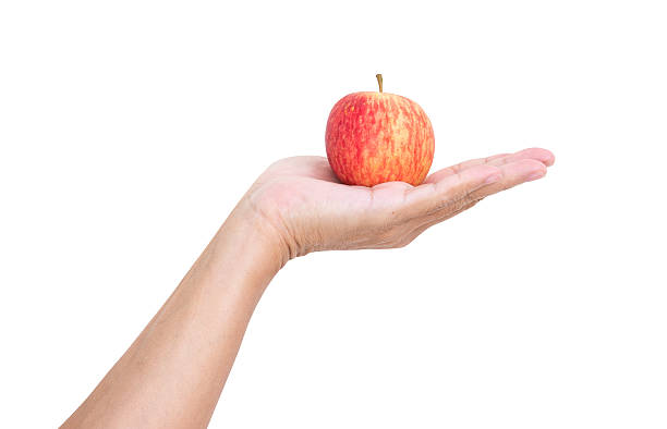 istock Man hand holding apple isolated on white background, clipping pa 498957031