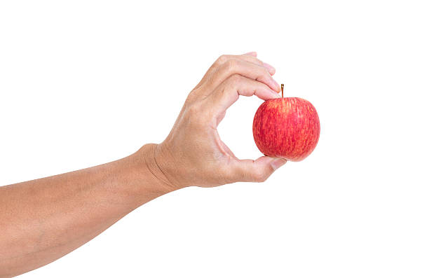 istock Man hand holding apple isolated on white background, clipping pa 498957247