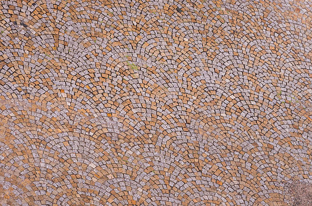 istock Old road paved with granite stones 498971034