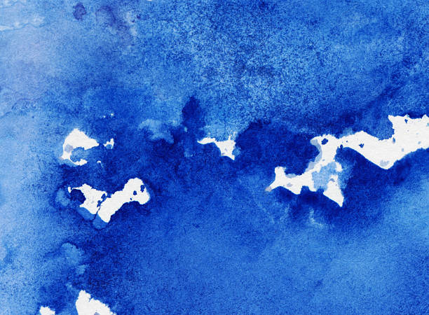 Hand painted blue splotches of paint on paper Hand painted watercolor and ink background. The prominent colors are hues of blue. There is a splotchy texture throughout the painting with drips and pools of paint. navy watercolor stock pictures, royalty-free photos & images