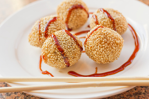 Fancy Chinese dessert sesame donuts with sweet brown sauce