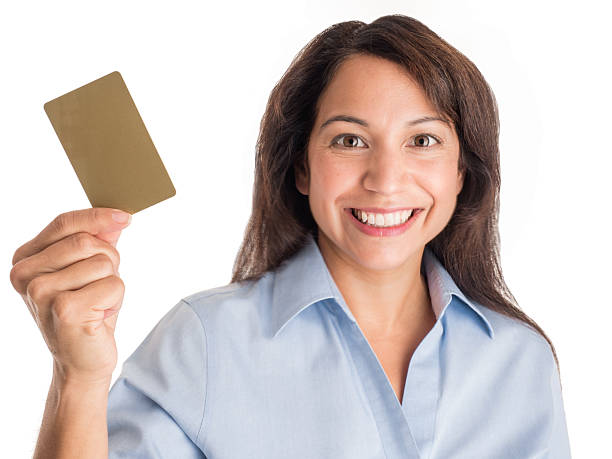Smiling Woman Displays Credit-Gift-Debit-Gold Card. stock photo