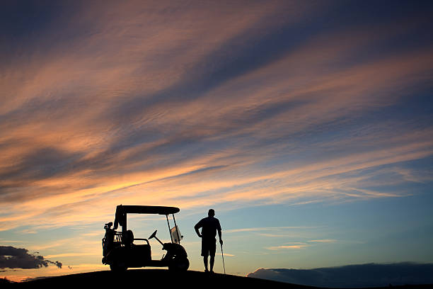 istock Unrecognizable Male Golfe Standing by His Golf Cart With Sky 498973362