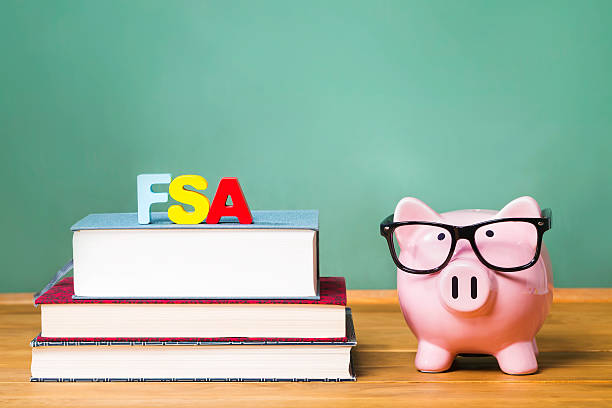 istock Federal Student Aid theme with pink piggy bank with chalkboard 498973368