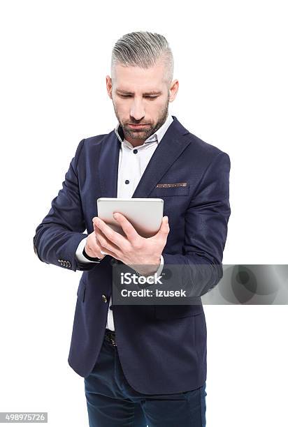 Bearded Grey Hair Businessman Using A Digital Tablet Stock Photo - Download Image Now