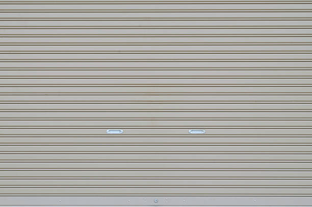 Corrugated metal sheet slide door stock photo