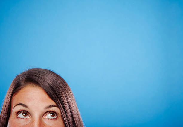 istock Young female against blue background 498975769