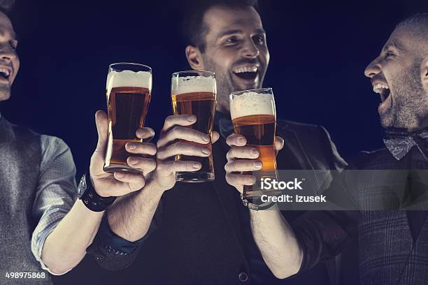 Happy Elegant Men Toasting With Beer Stock Photo - Download Image Now - Beer - Alcohol, Celebratory Toast, Beer Glass