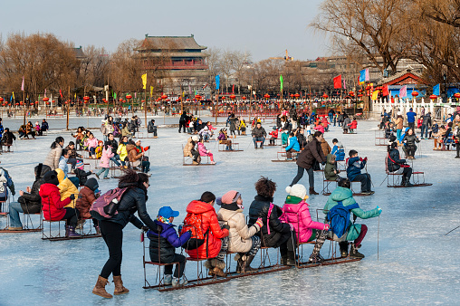 People have a fun with the sledge during the winter time, Beijing