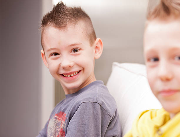 two kids playing video games two little boys having lots of fun with video games stars in your eyes stock pictures, royalty-free photos & images