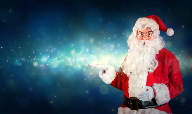 istock Santa Claus Showing With Hand Something Magical 498976994