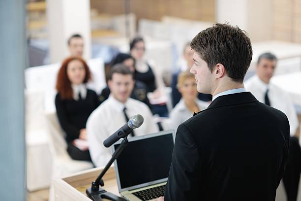istock Young  business man giving a presentation on conference 498977253