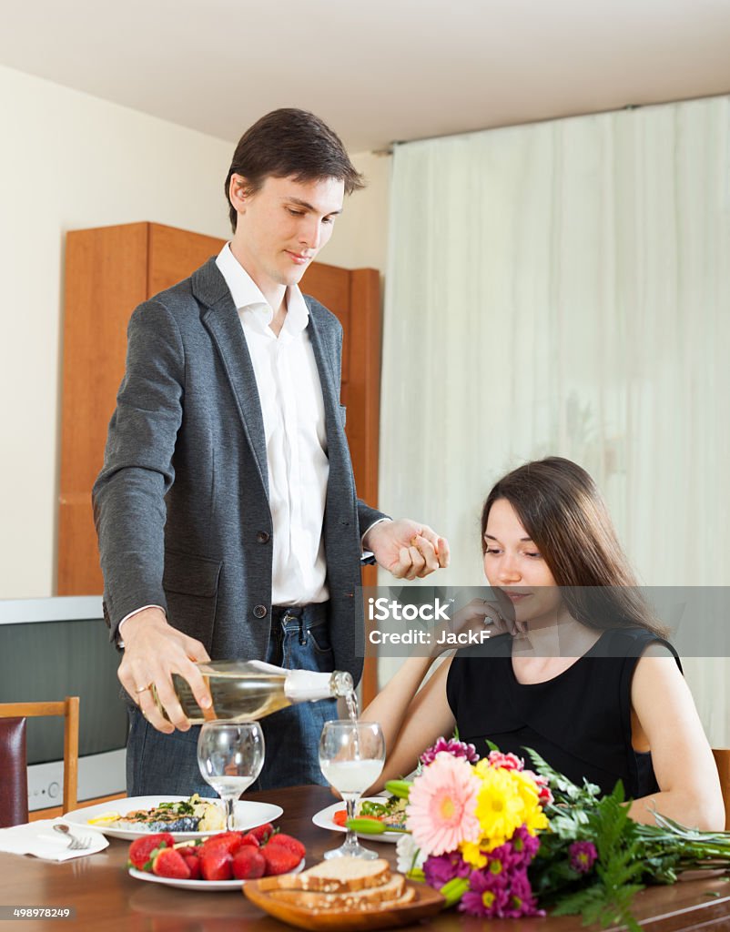 Man pours champagne lady Man pours champagne lady during a romantic dinner 20-29 Years Stock Photo