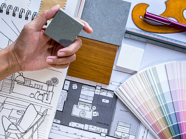istock Interior designer's  hand working with illustration sketch and color samples 498978327