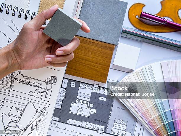 Interior Designers Hand Working With Illustration Sketch And Color Samples Stock Photo - Download Image Now