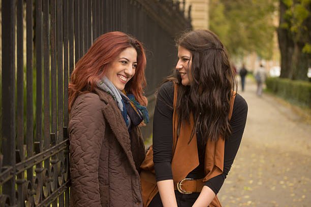 istock Two young close by, intimate girls, sitting in lap 498979350