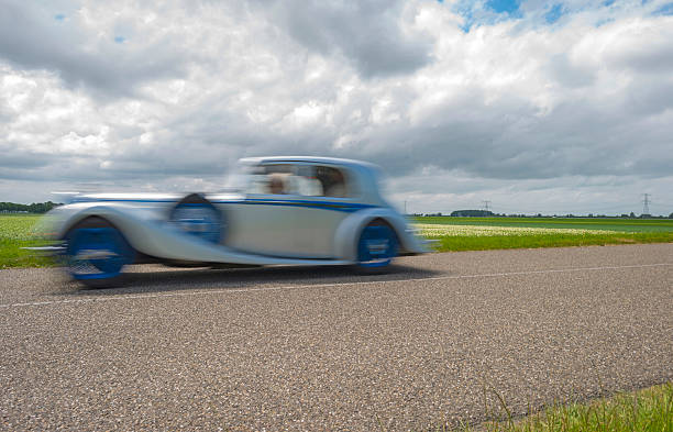 istock Vitage car racing through the countryside 498981151
