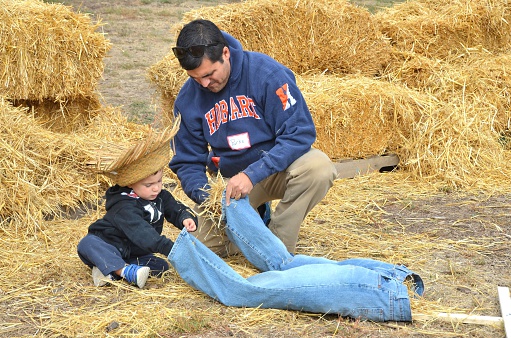 Denver, CO, USA - October 3, 2015: Denver's Four Mile Historic Park's annual family friendly Pumpkin Fall Festival. Open to all ages and both admission/parking are free! With old time music, homemade caramel apples, a pumpkin patch, crafts, a pie eating contest, horse drawn wagon rides and more there's sure to be something for everyone to enjoy! 