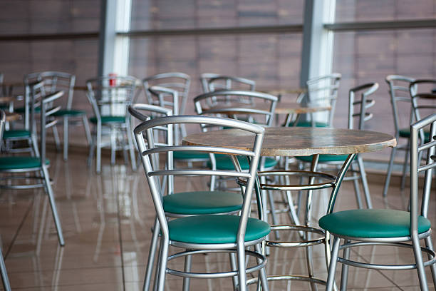 istock tables and chairs in a cafe 498985740