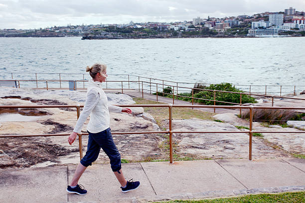 Mature women exercising at the beach