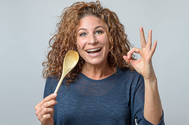 istock woman with a wooden spon 498986458