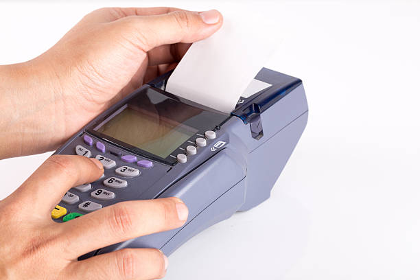 istock Hand with Credit card machine isolated on white background 498992494