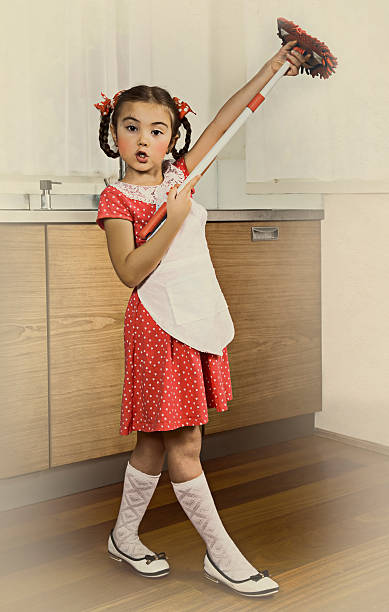 istock Little girl with mop 498993016