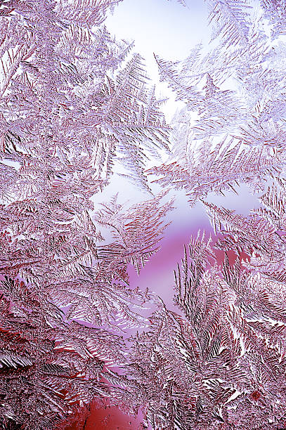 Beautiful Winter Window Pane Coated By Icy Frost Shiny Patterns stock photo