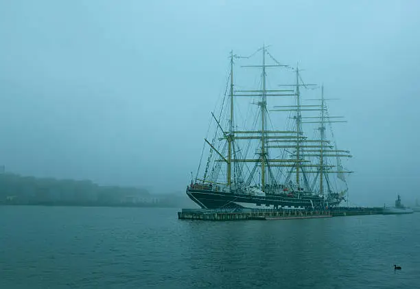 Sailing barque on the river in the fog in Saint Petersburg, Russia