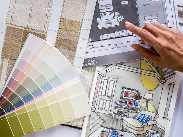 istock Interior designer's  hand working with illustration sketch and color samples 498995091