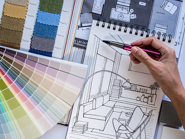 istock Interior designer's  hand working with illustration sketch and color samples 498995099