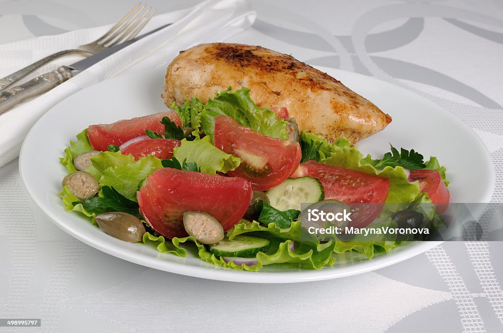 Garnished with vegetables with chicken schnitzel Easy  garnish  of fresh vegetables with chicken schnitzel Appetizer Stock Photo