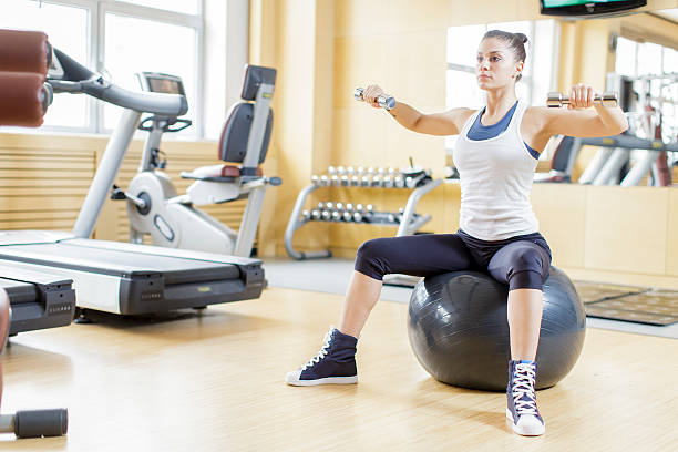 istock Young woman training in the gym 498996013