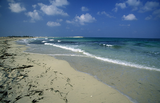 A sandy beach on the island of Jierba in the south of Tunisia in North Africa.