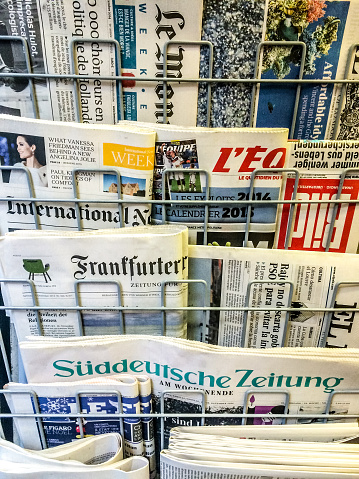 Variety of international newspapers sold on Milan street
