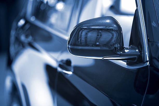 istock Dark blue Car side mirror at dealership - background 498998611