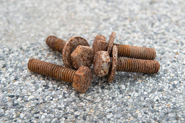 istock The old rusty bolts and nuts on the floor. 498999671