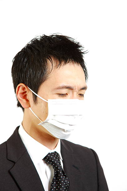 istock Japanese businessman with mask 498999821
