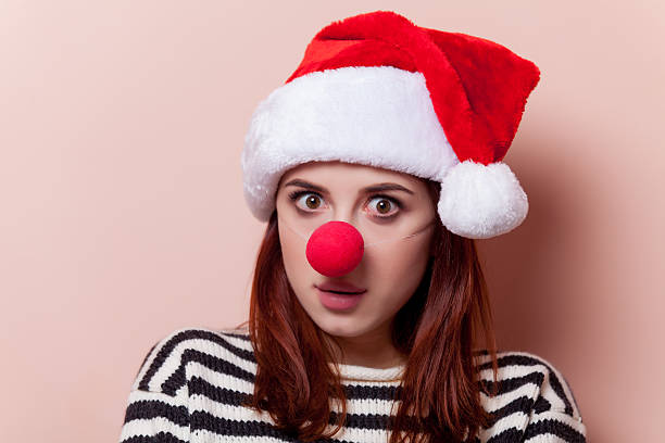 istock woman with red clown nose 499000064