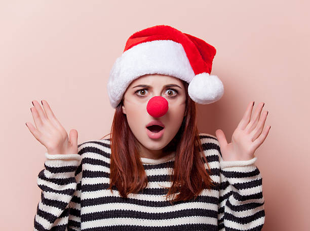 istock woman with red clown nose 499000140
