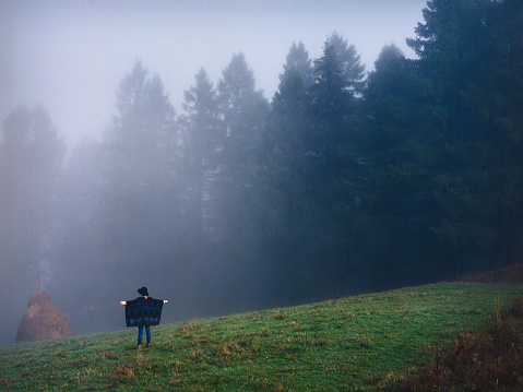 Woman in the foggy field 